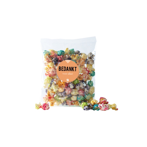 Zak gekleurde popcorn met tekst Bedankt.